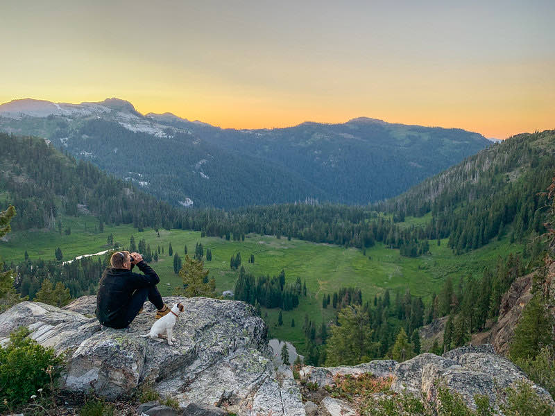 Sunset over a green valley in the Marble Mountains